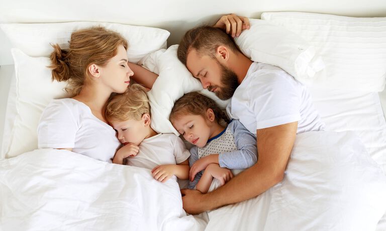 family sleep in bed